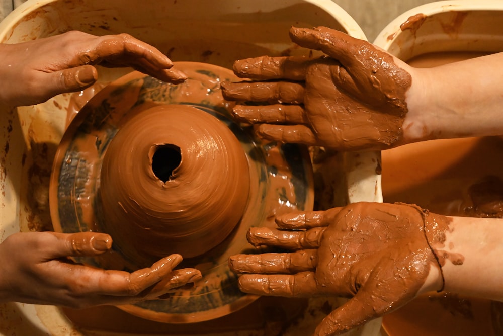 a close-up of hands holding a wheel