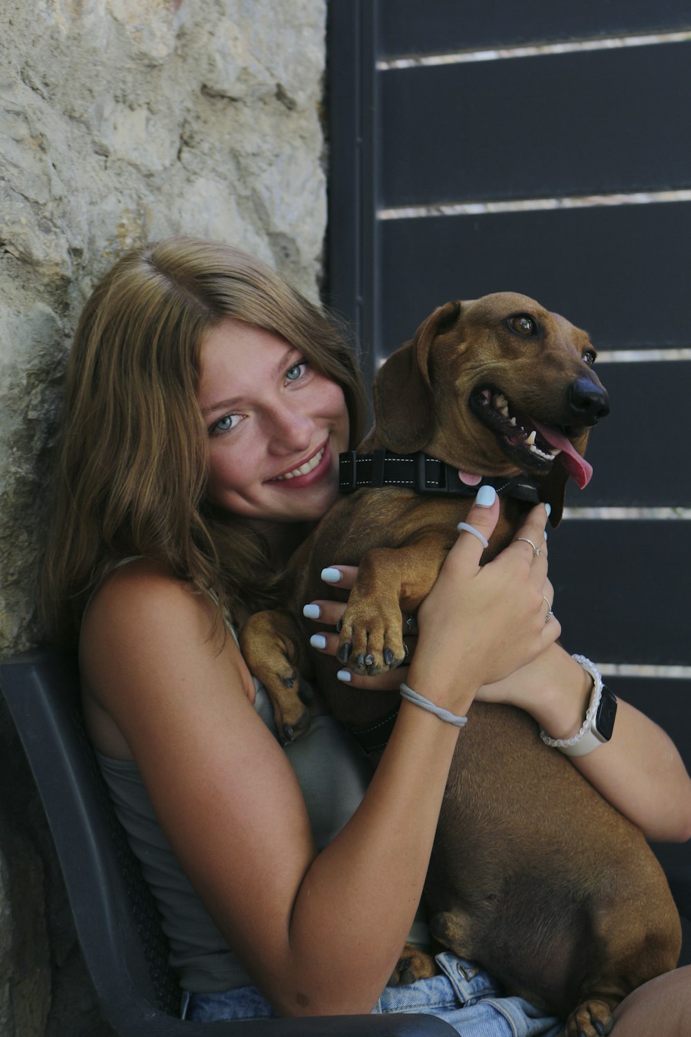 a woman holding a dog