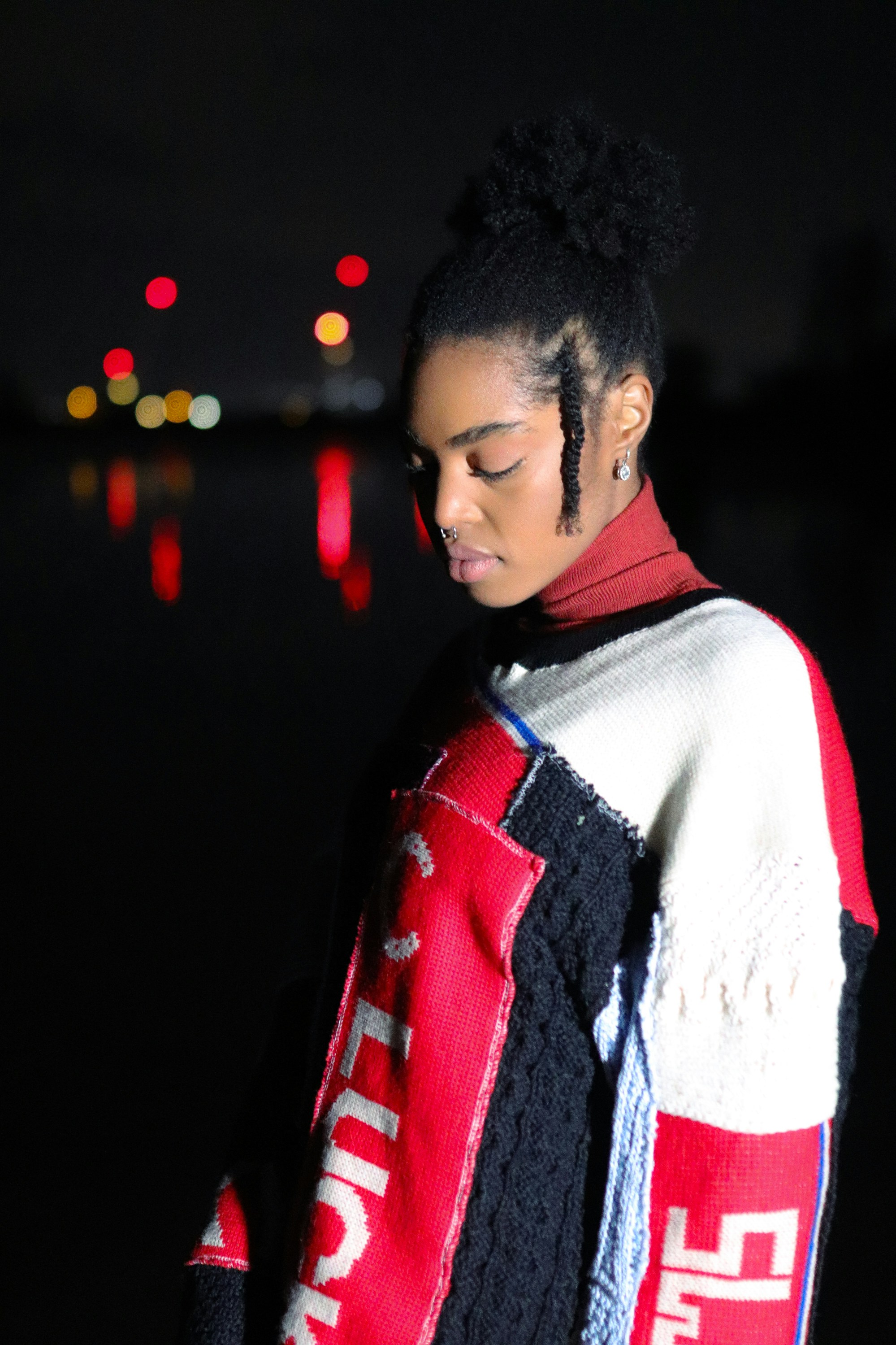 a person with a red and white scarf on the head