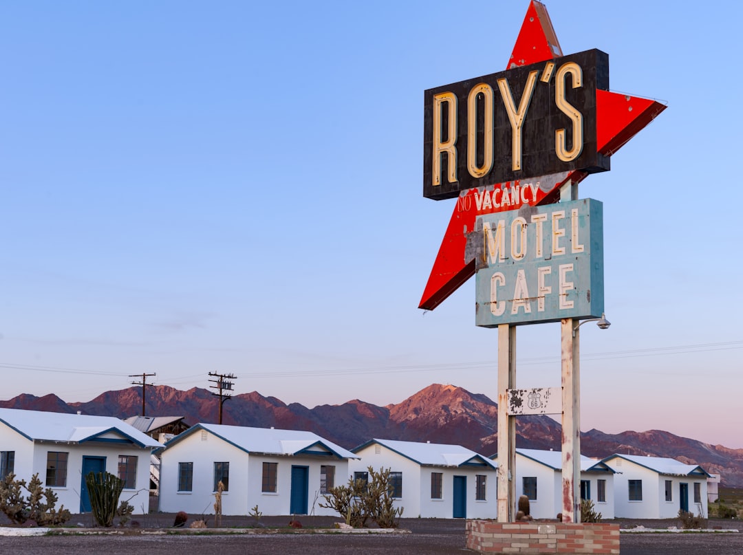 a sign in front of a town, The iconic Roy
