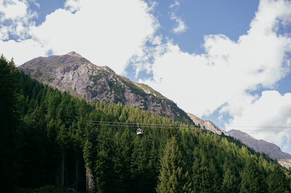 a cable car going up a mountain