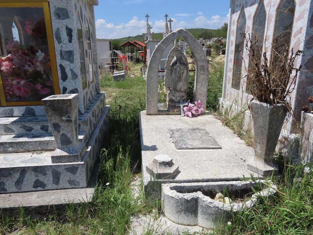 a cemetery with tombstones and flowers