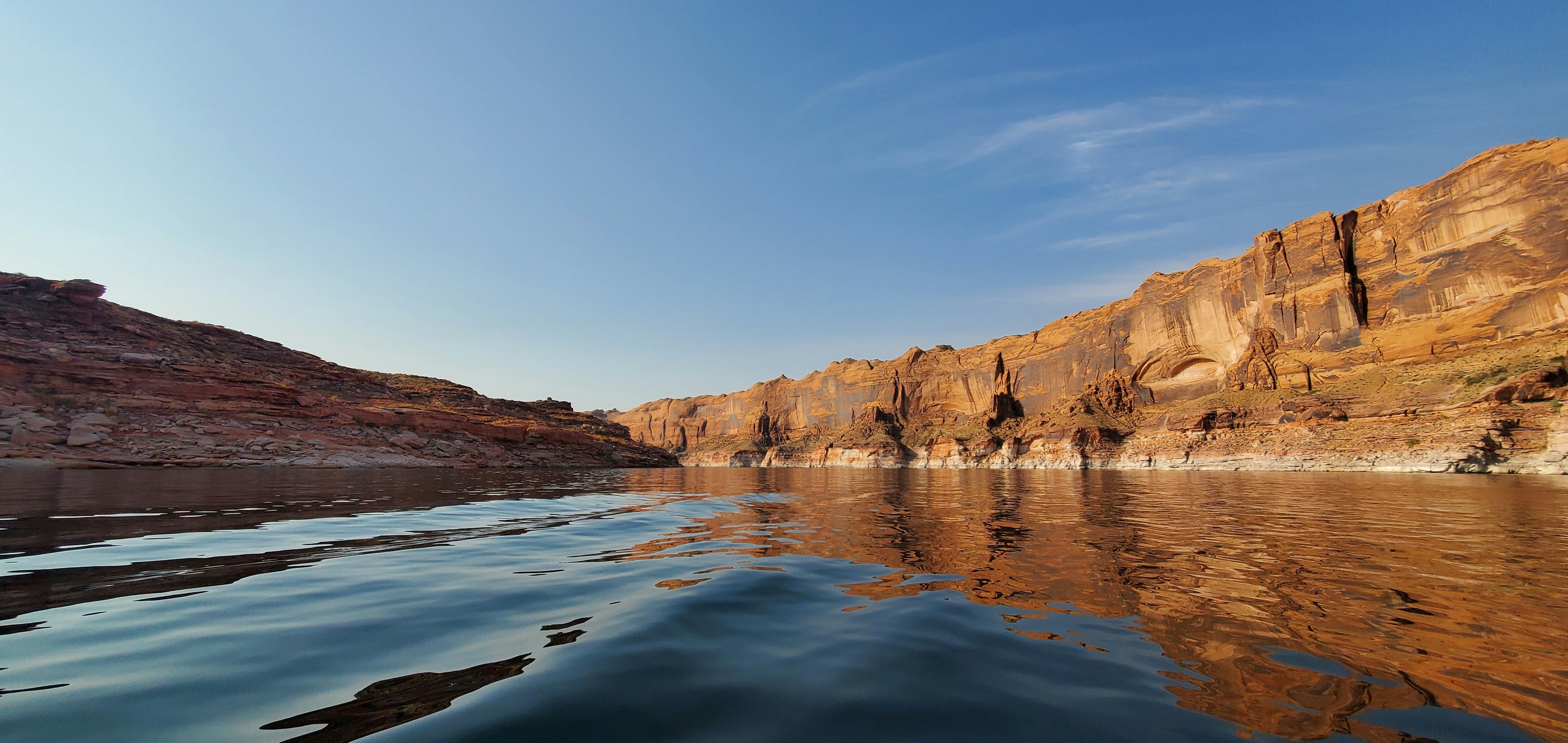 a body of water with hills in the background