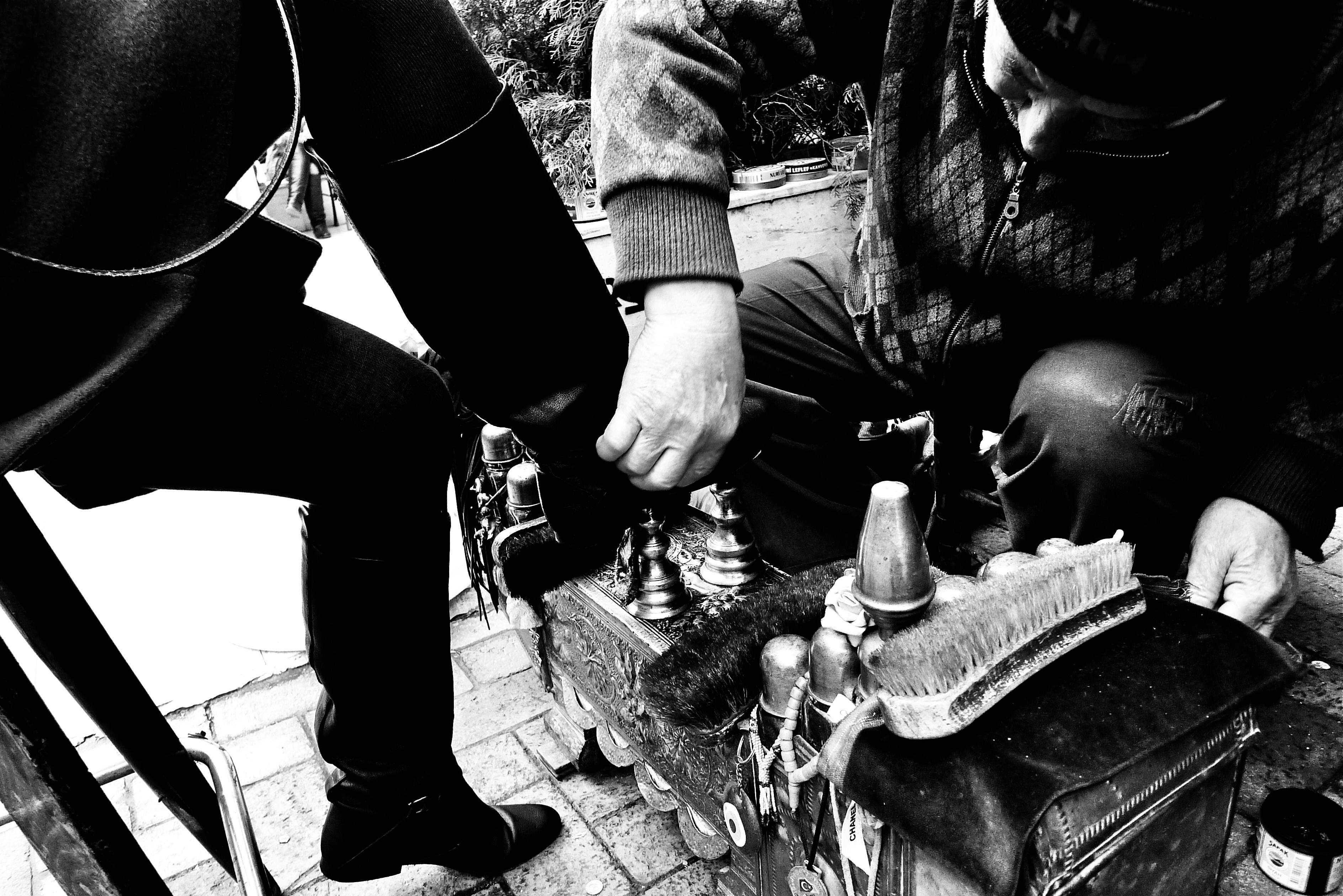 a person working on a person's shoe