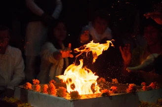 a group of people around a fire