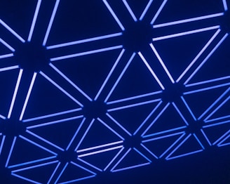 A sleek honeycomb pattern glowing with blue gradients, evoking a futuristic network grid.