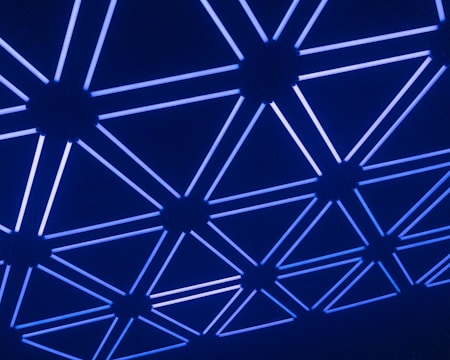 A sleek honeycomb pattern glowing with blue gradients, evoking a futuristic network grid.