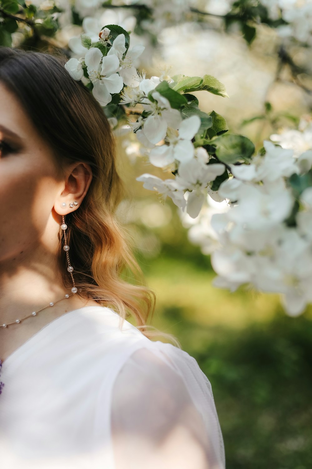 a woman smelling a flower