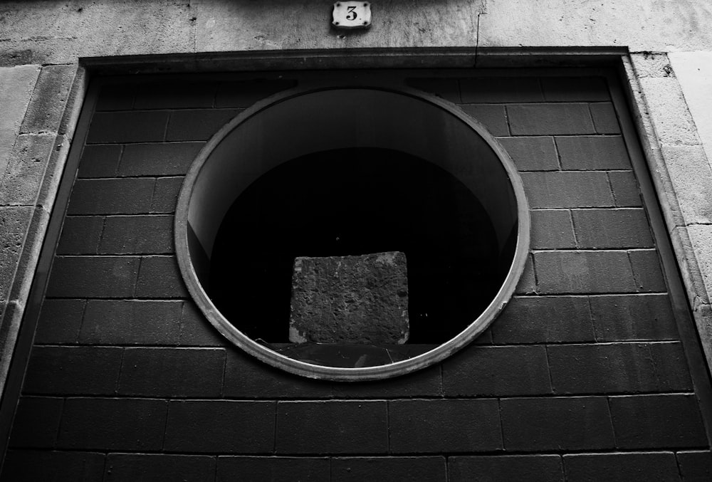a round black hole in a brick wall