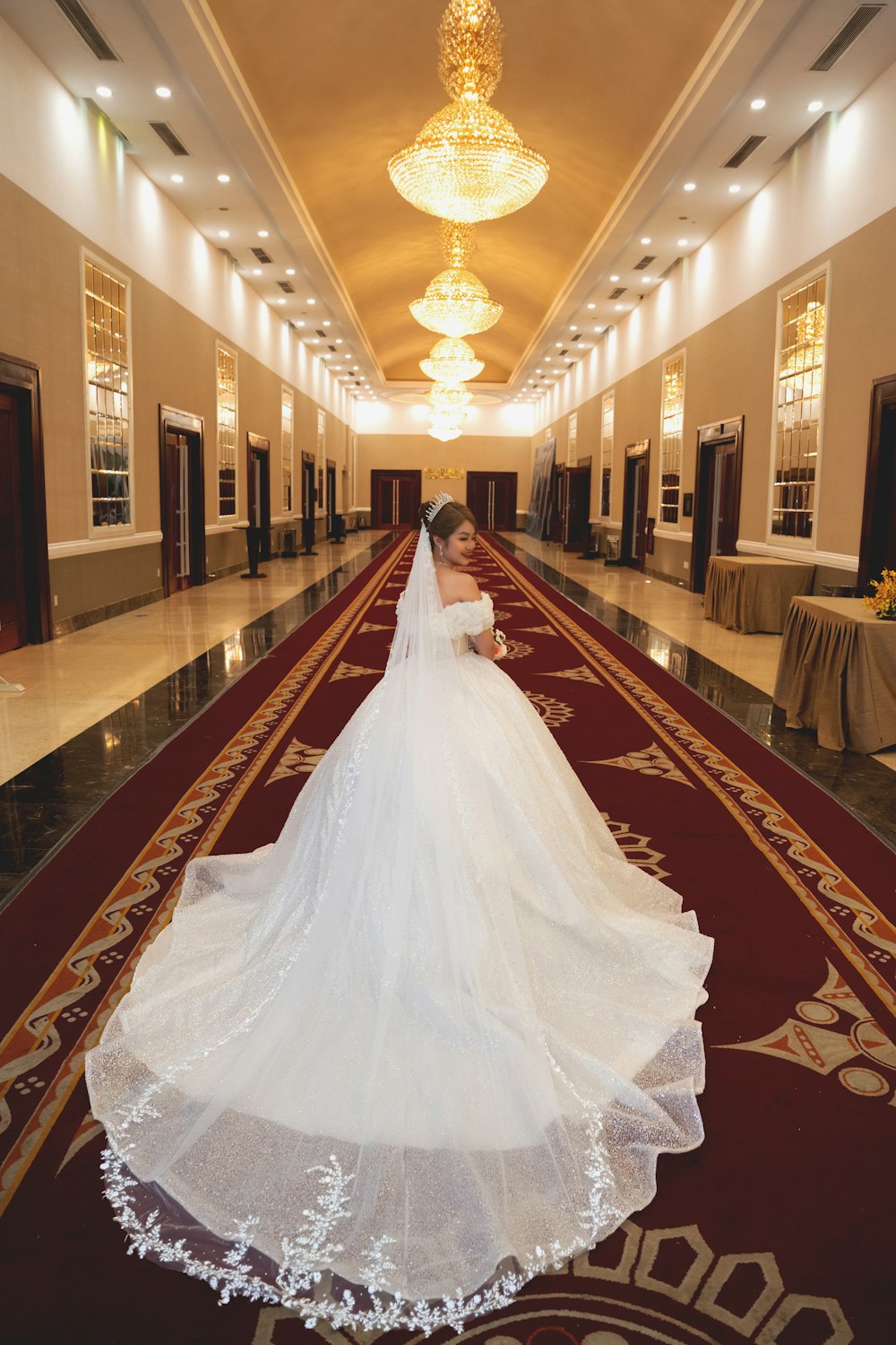 a person in a dress in a large hall