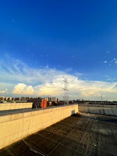 Rooftop view of a commercial building with city skyline.