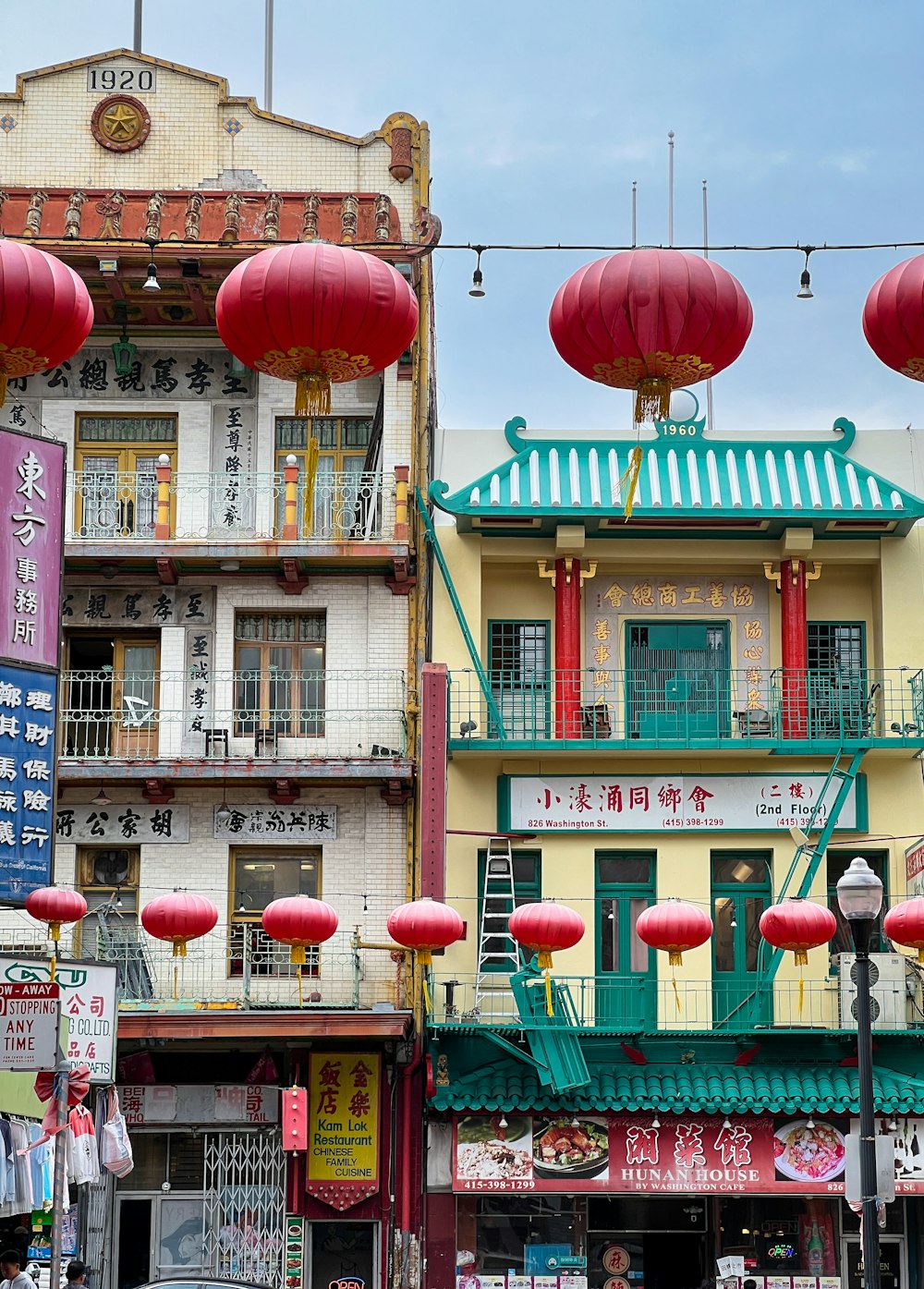 a row of buildings with lanterns