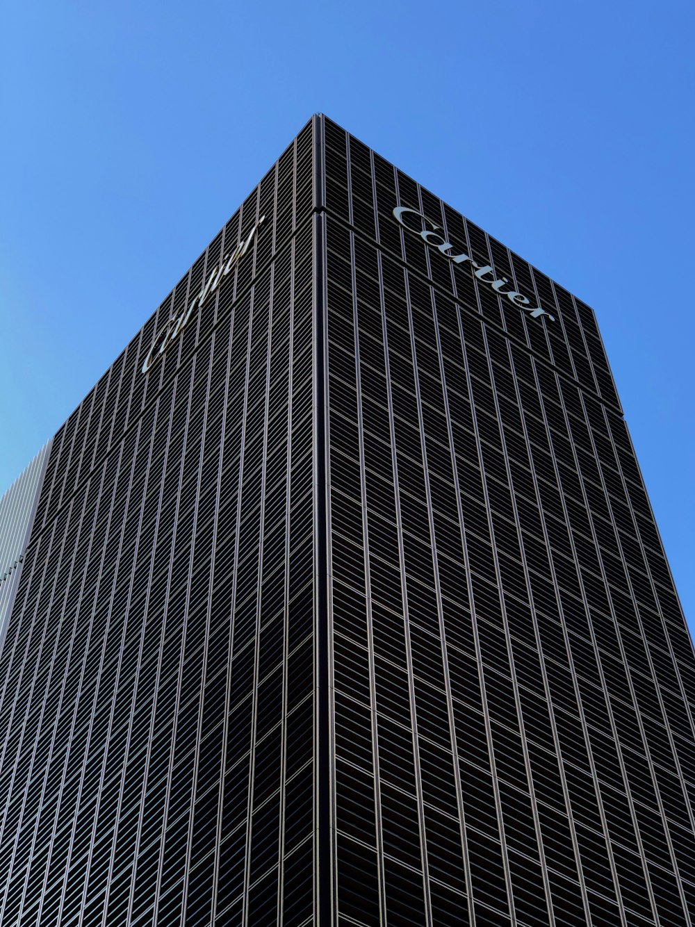 a tall building with a blue sky