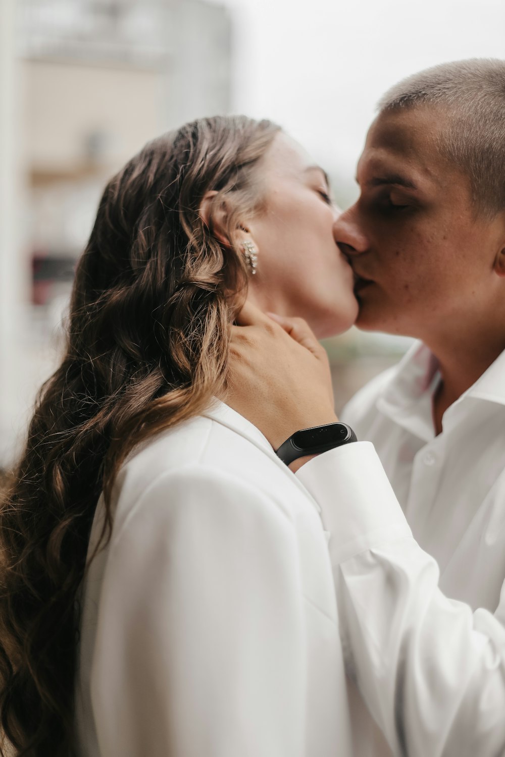 a man and woman kissing