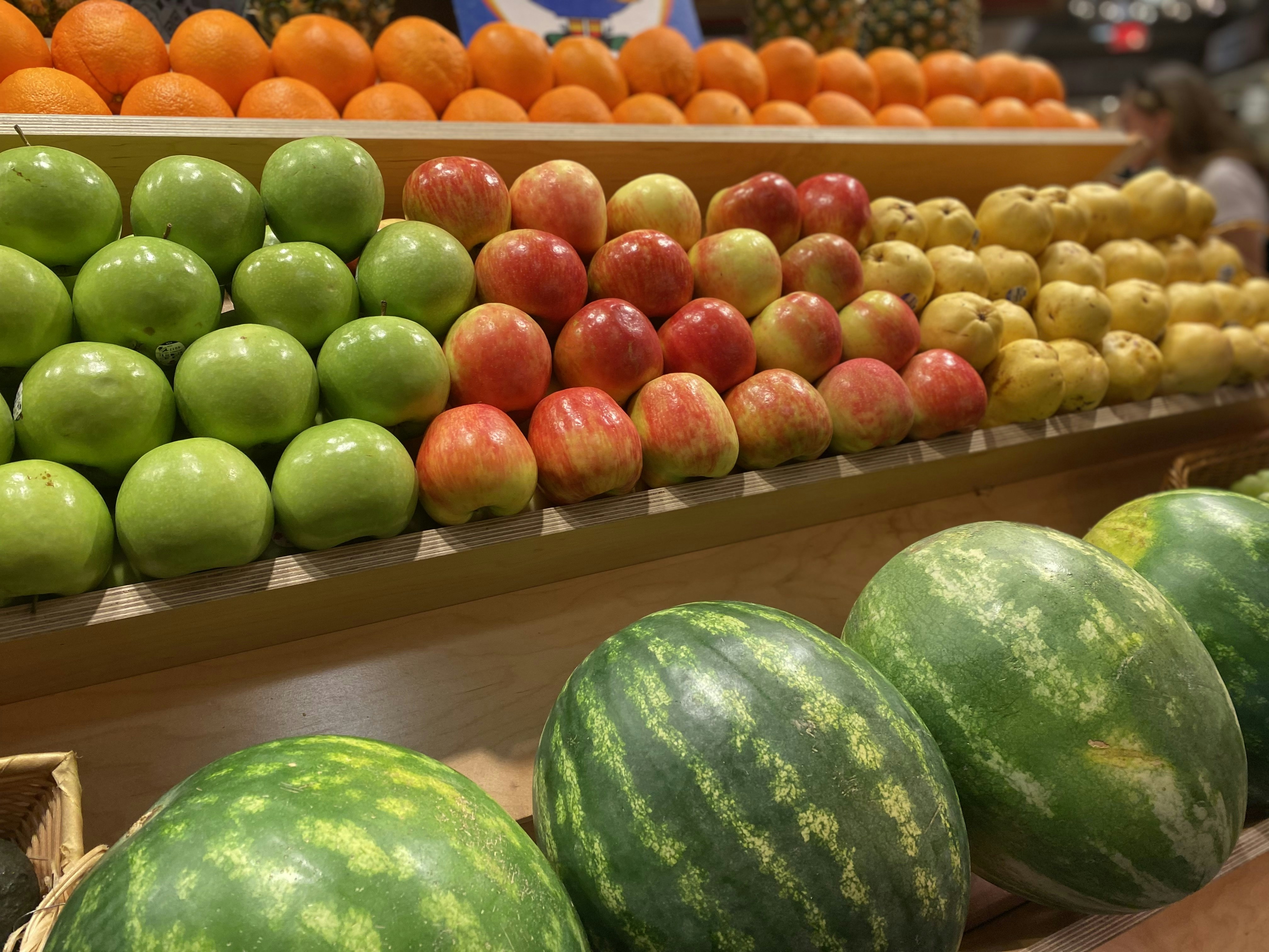Watermelons and apples on a table