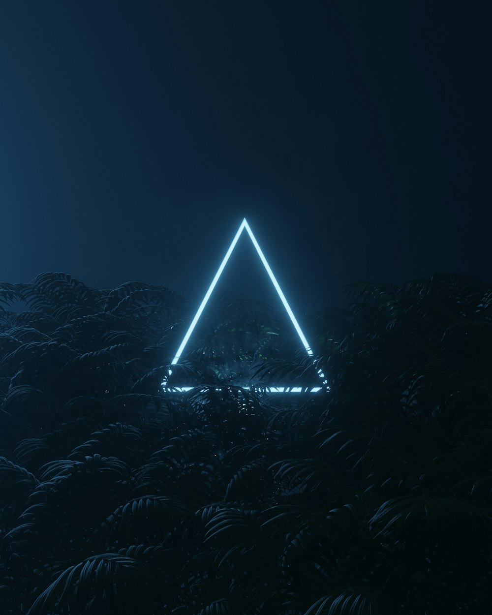 a large pyramid with lights at night