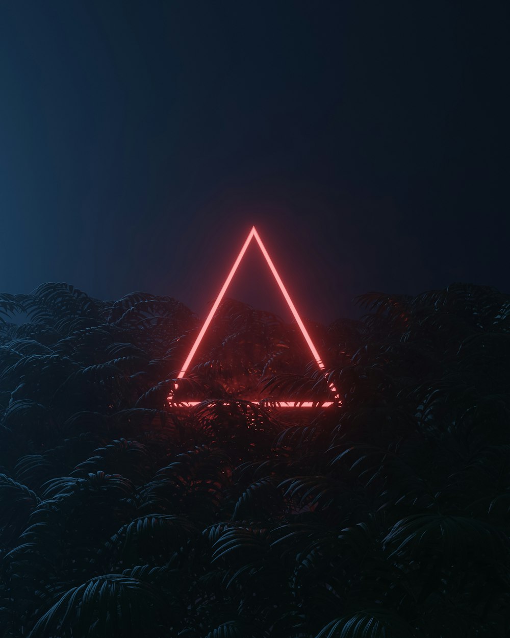 Eine große Pyramide mit Lichtern in der Nacht