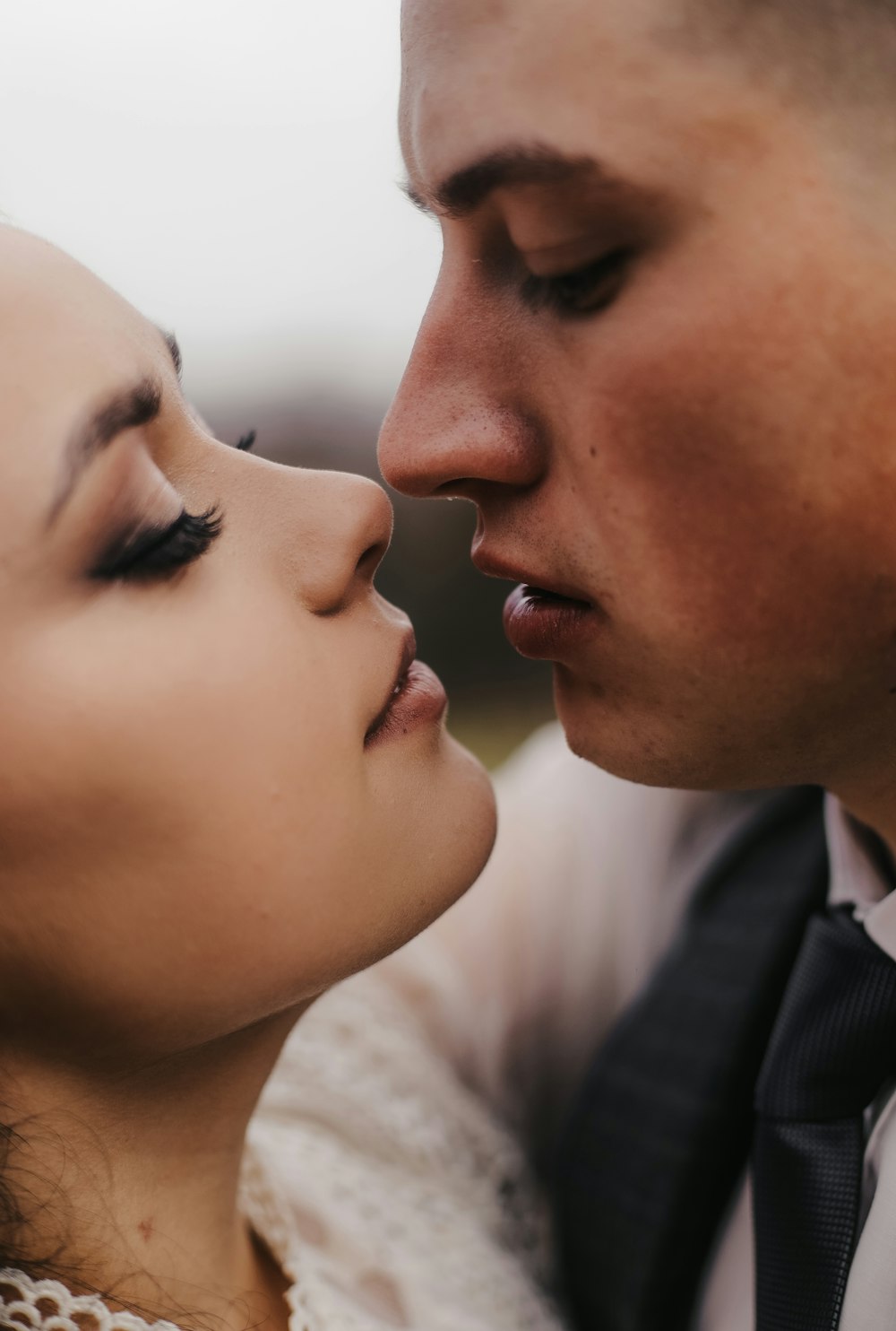 a man and woman kissing