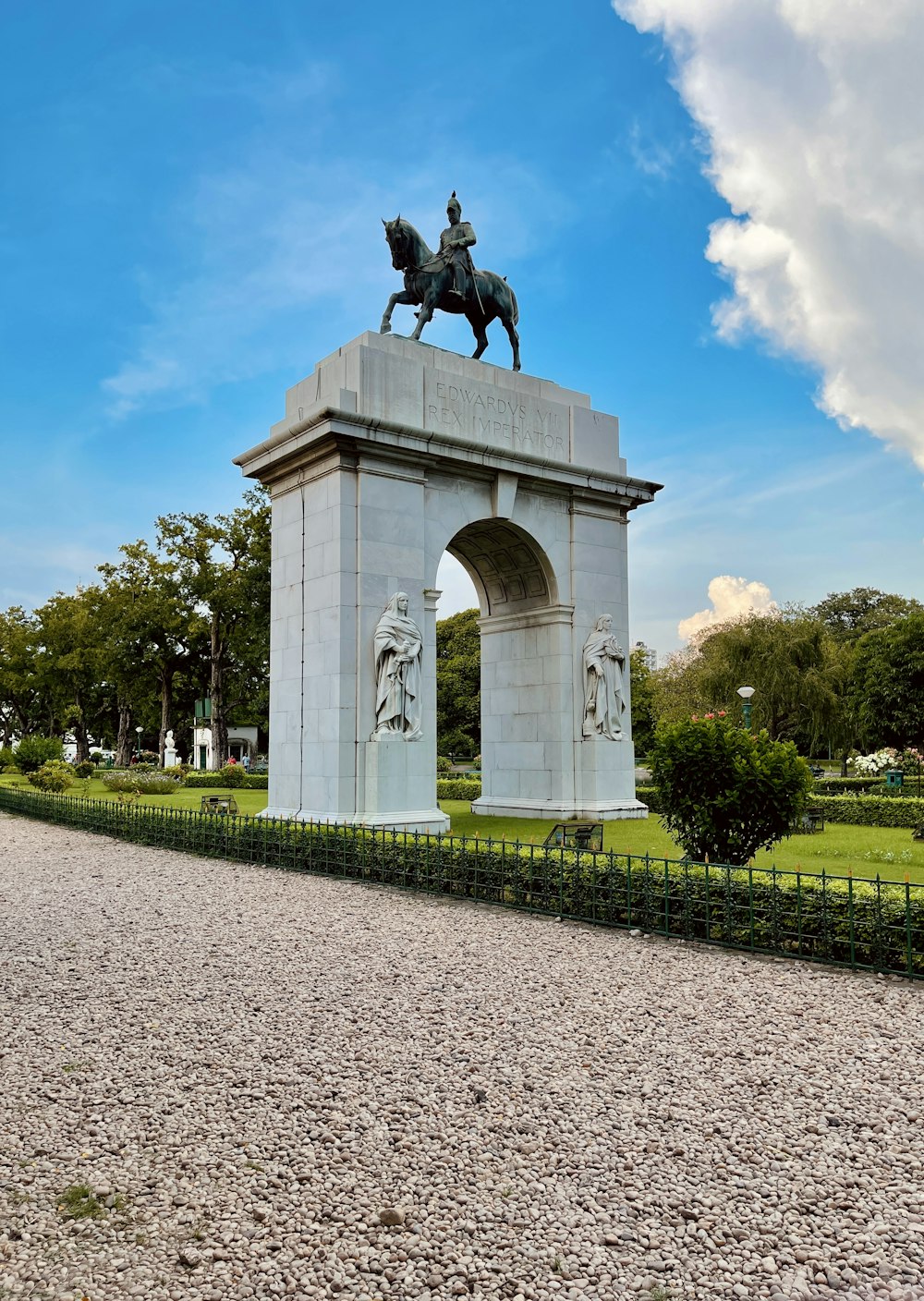 a statue of a person on a horse on a stone structure