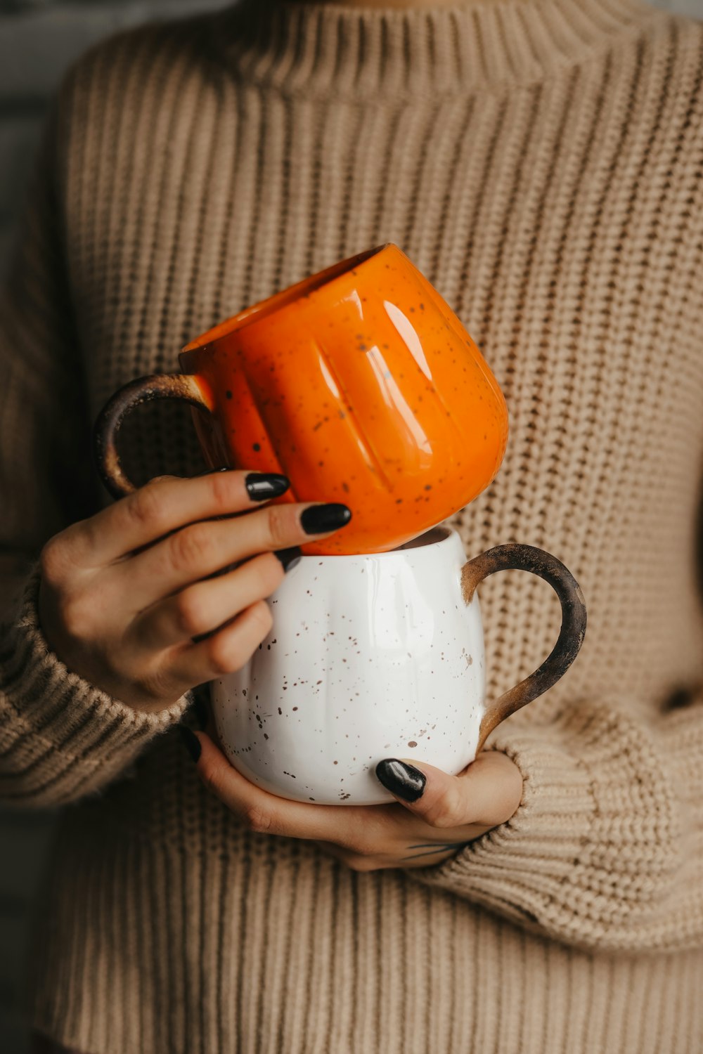 a person holding a teapot