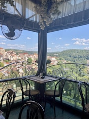 a table and chairs on a balcony
