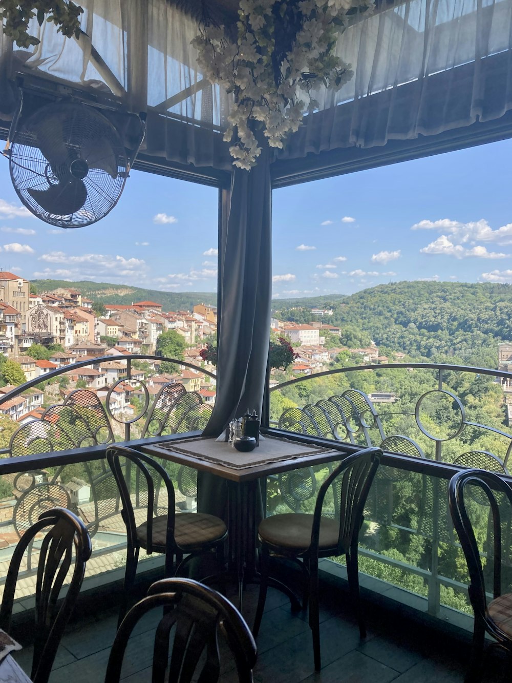 a table and chairs on a balcony