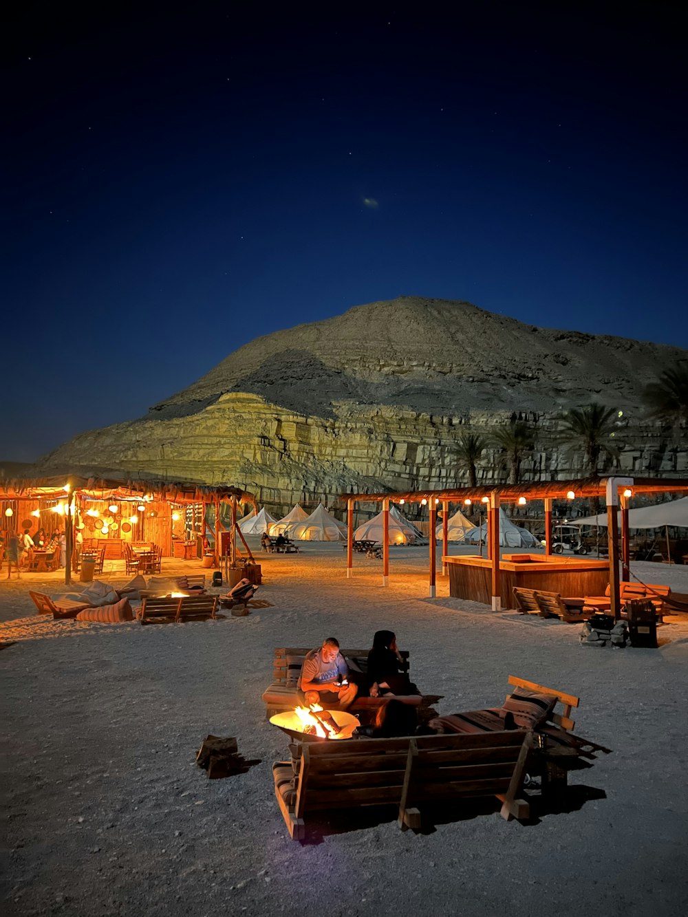 a beach with a mountain in the background