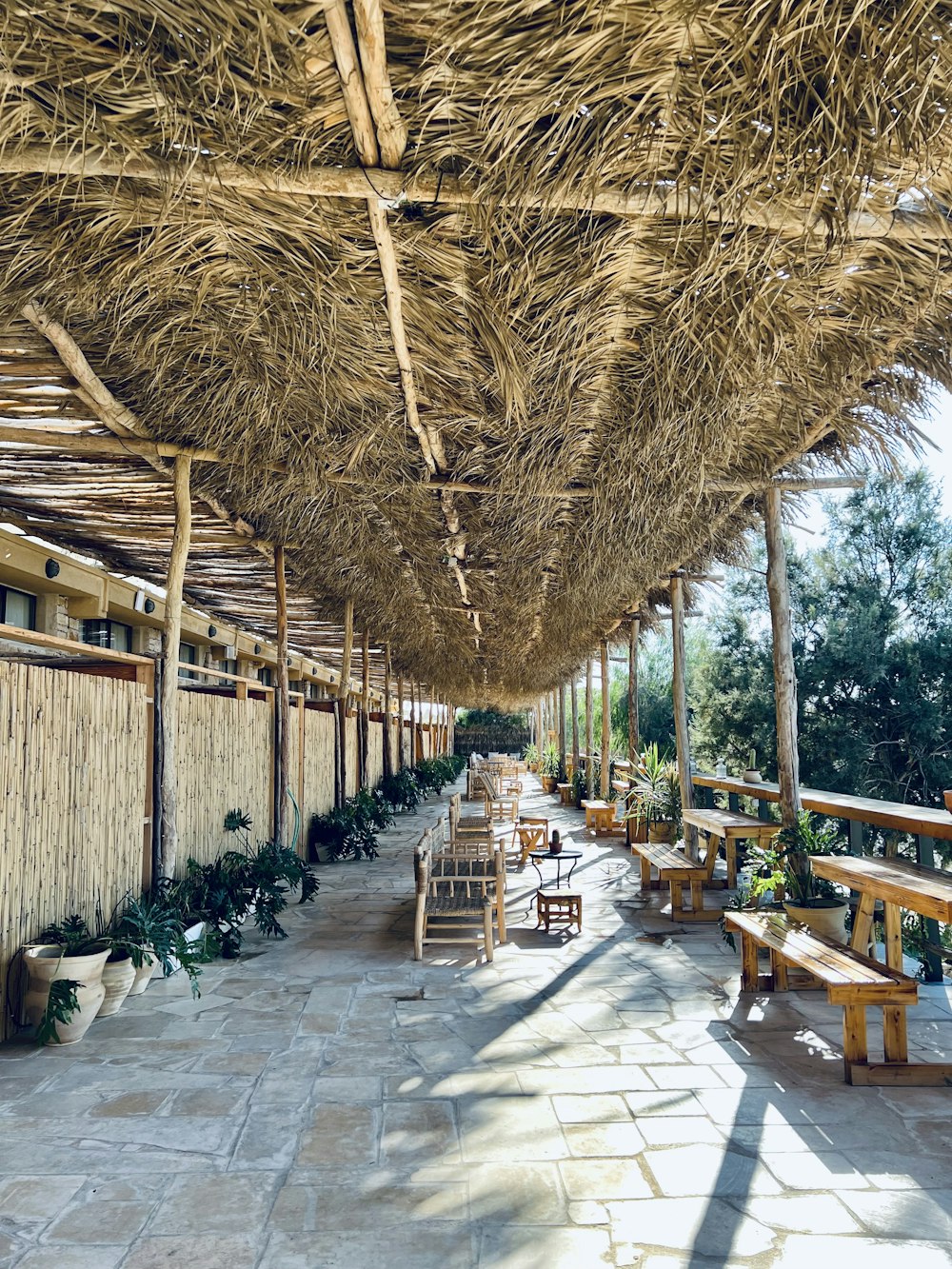 a patio with tables and chairs