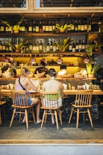 a group of people sitting at a bar