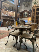 A cozy Scandinavian-style restaurant table set with rustic dishes and warm lighting.