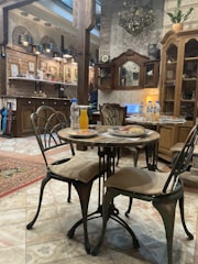 A cozy rustic restaurant table set with traditional dishes from the 65 region.