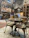 Cozy Scandinavian-style restaurant interior with warm lighting and a rustic wooden table set for dinner.