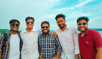 A lively group photo of the Khoni Palava team standing together in Dombivali East, smiling under a clear blue sky.