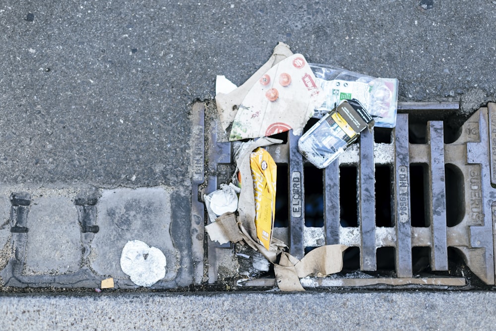 a pile of trash on a sidewalk