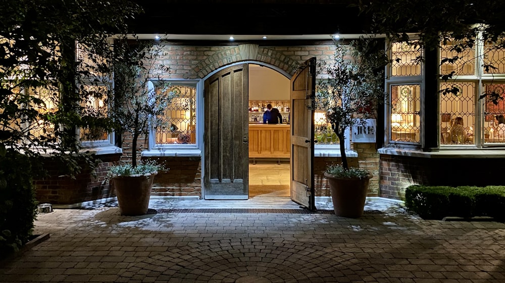 a building with a brick patio and a brick walkway