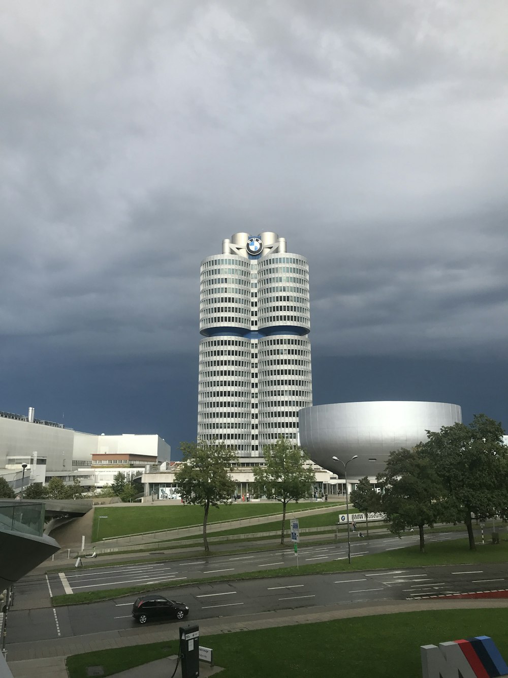 a tall building with a parking lot