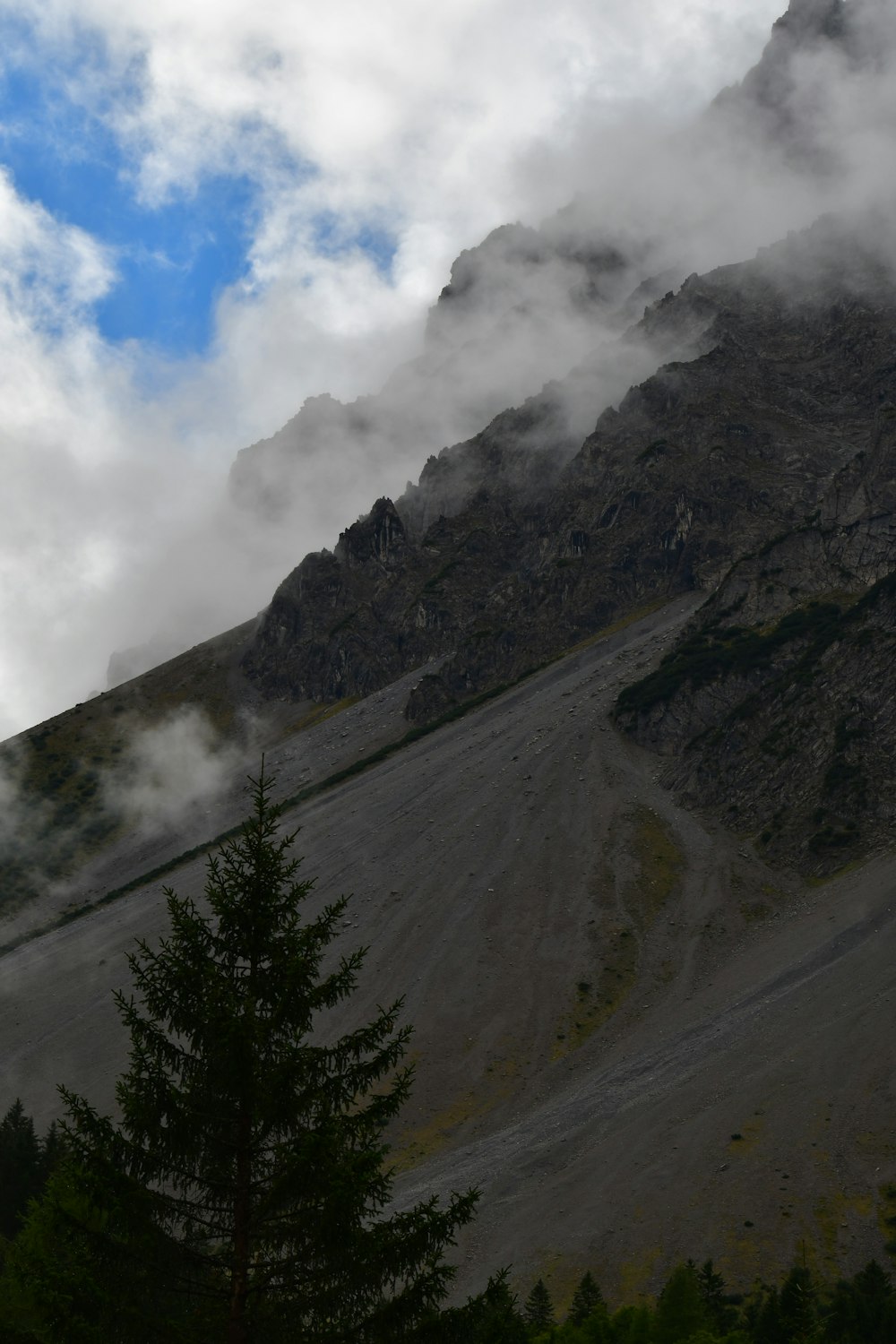 a mountain with clouds