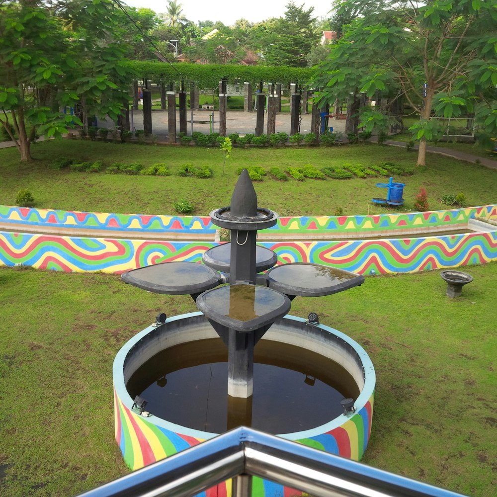 a water fountain in a park