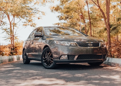 a black car parked on a road