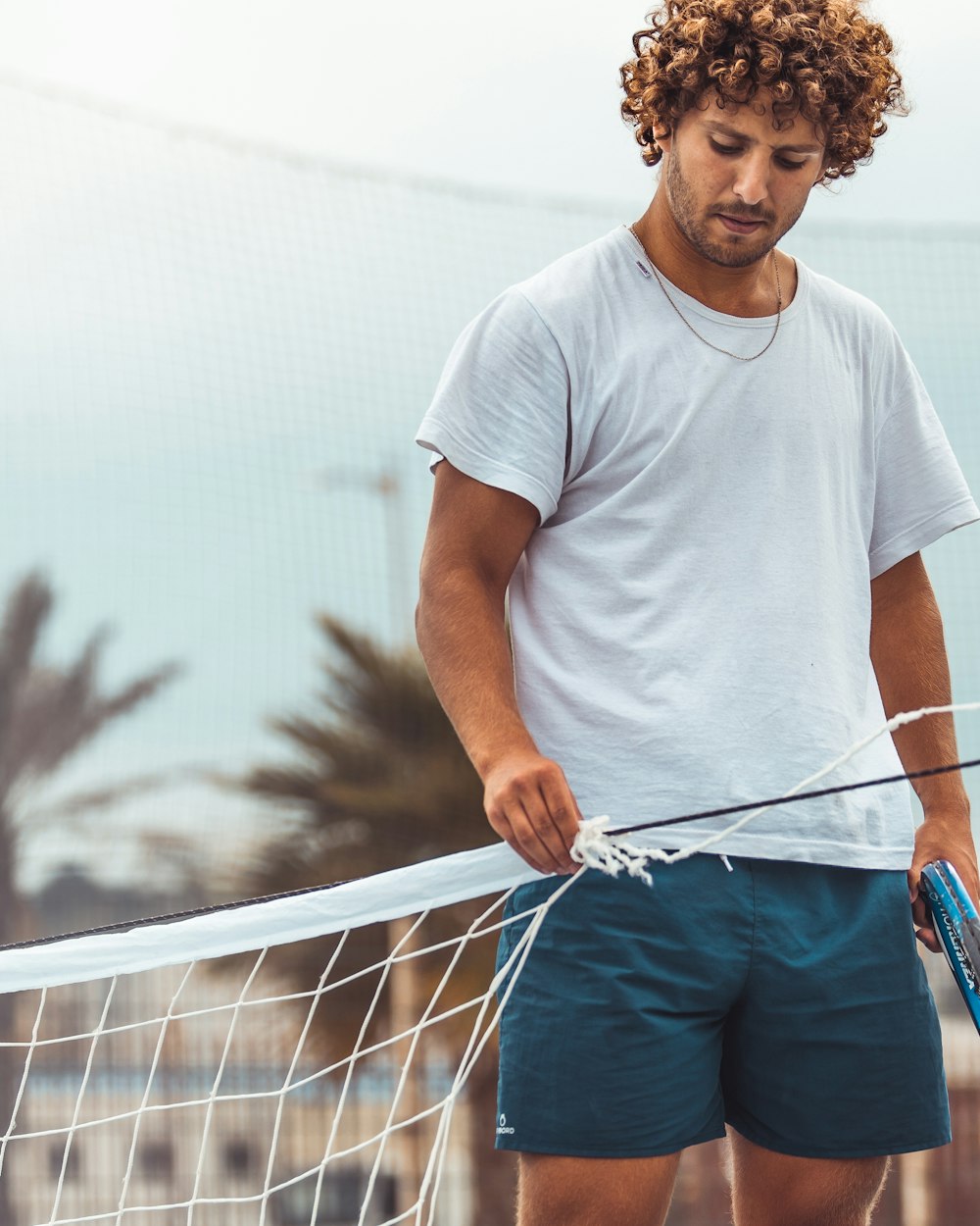 a man holding a tennis racket