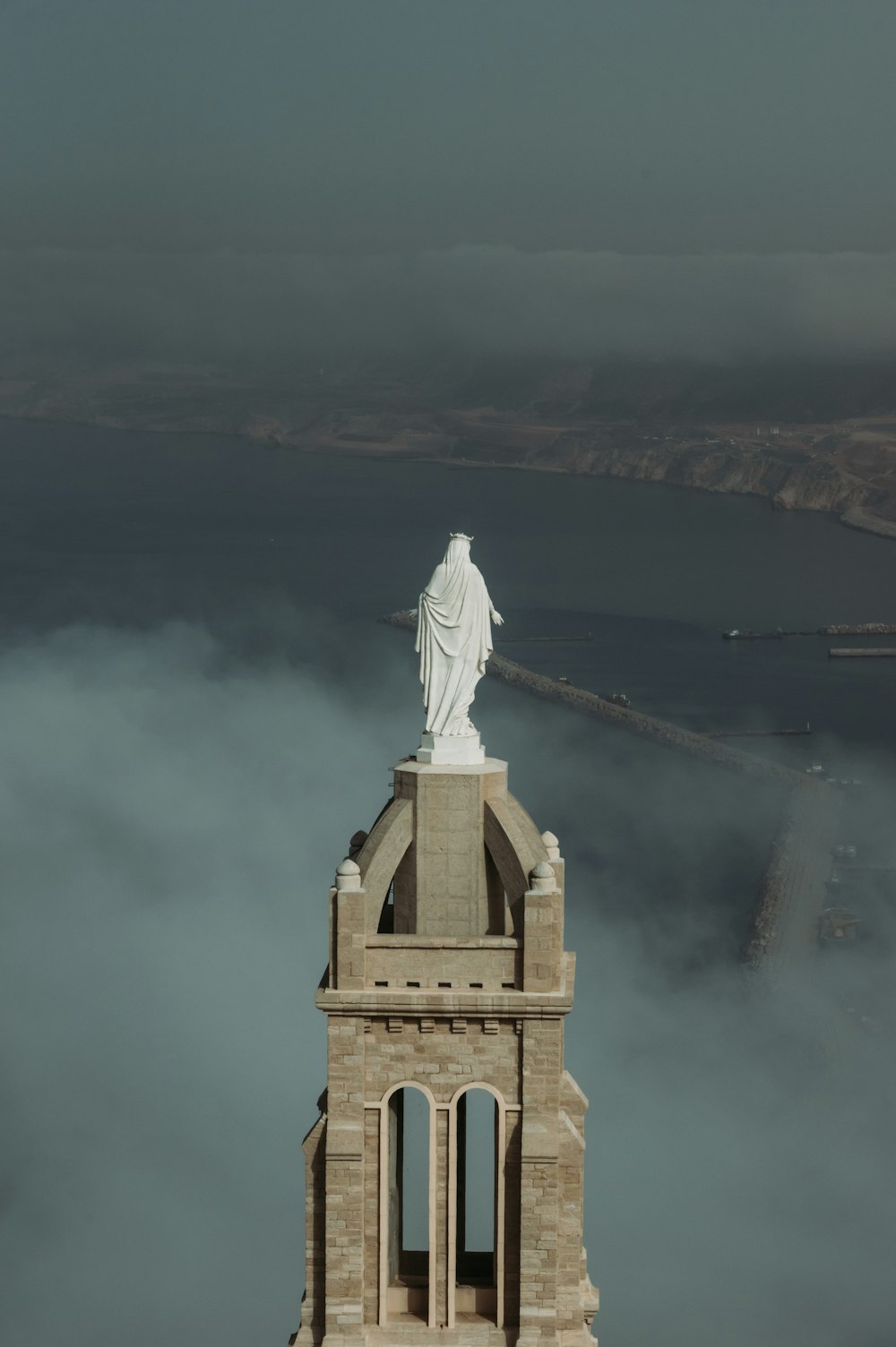 a statue on a tower