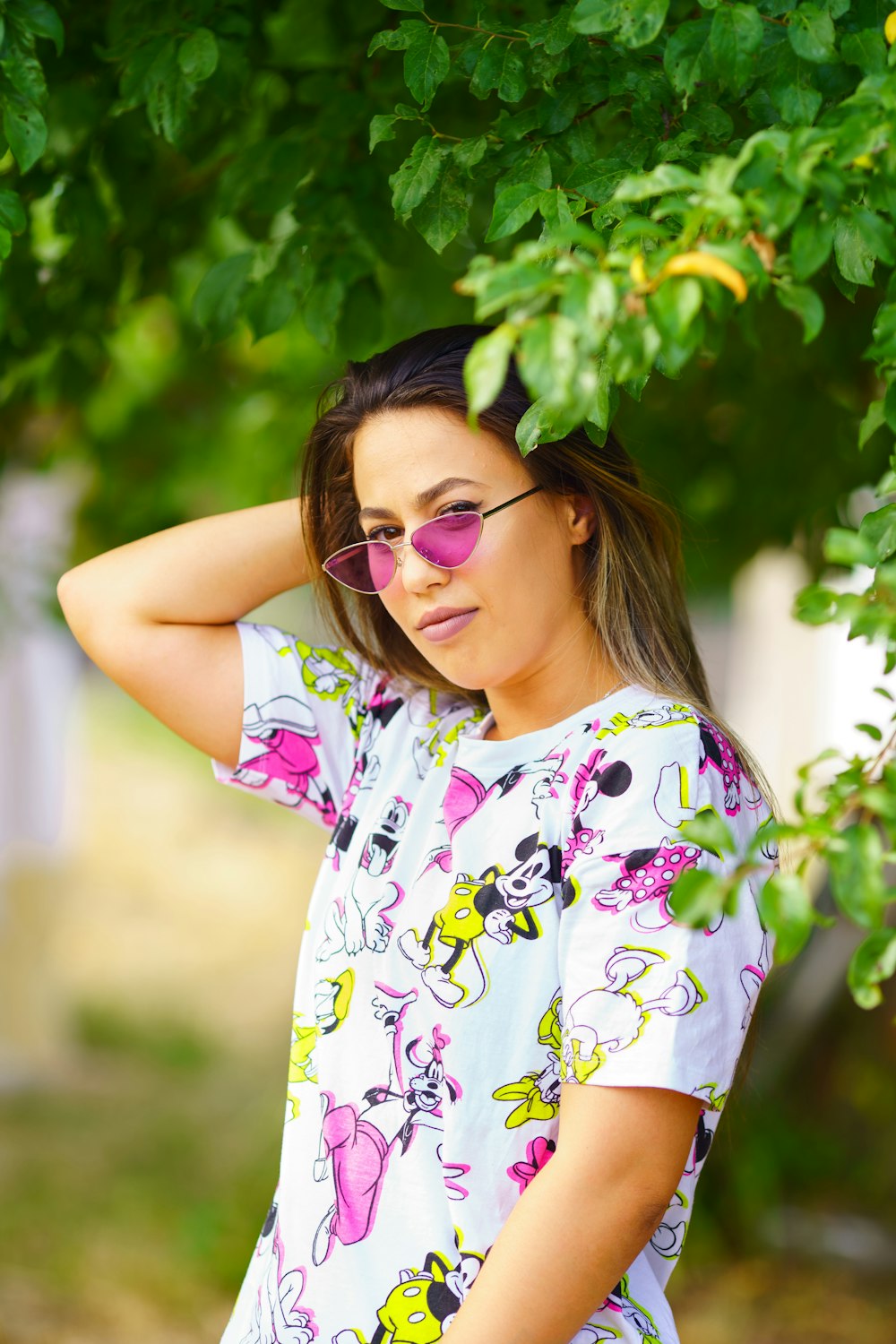 a woman wearing pink sunglasses