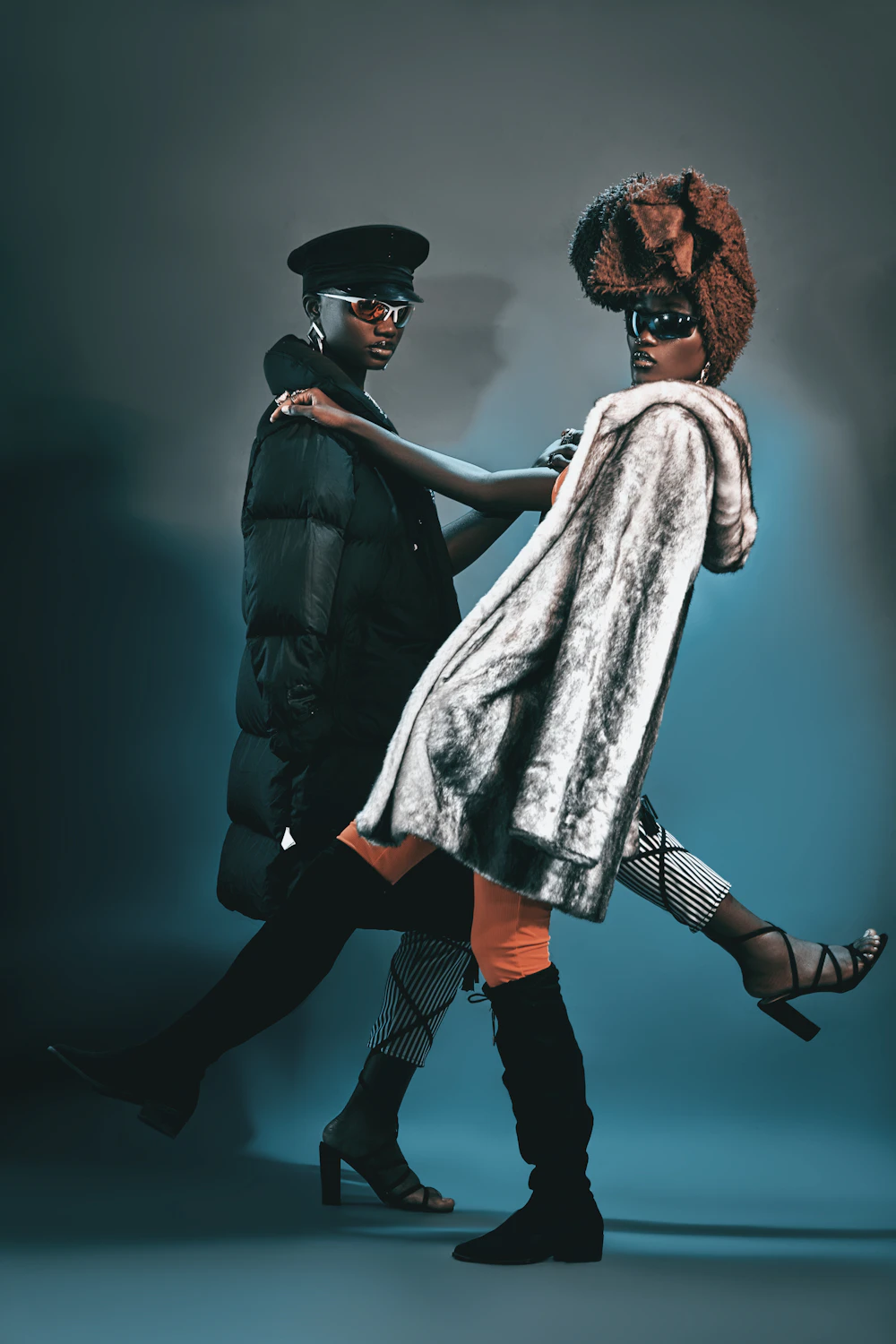 Two people in stylish outfits in an editorial fashion shot
