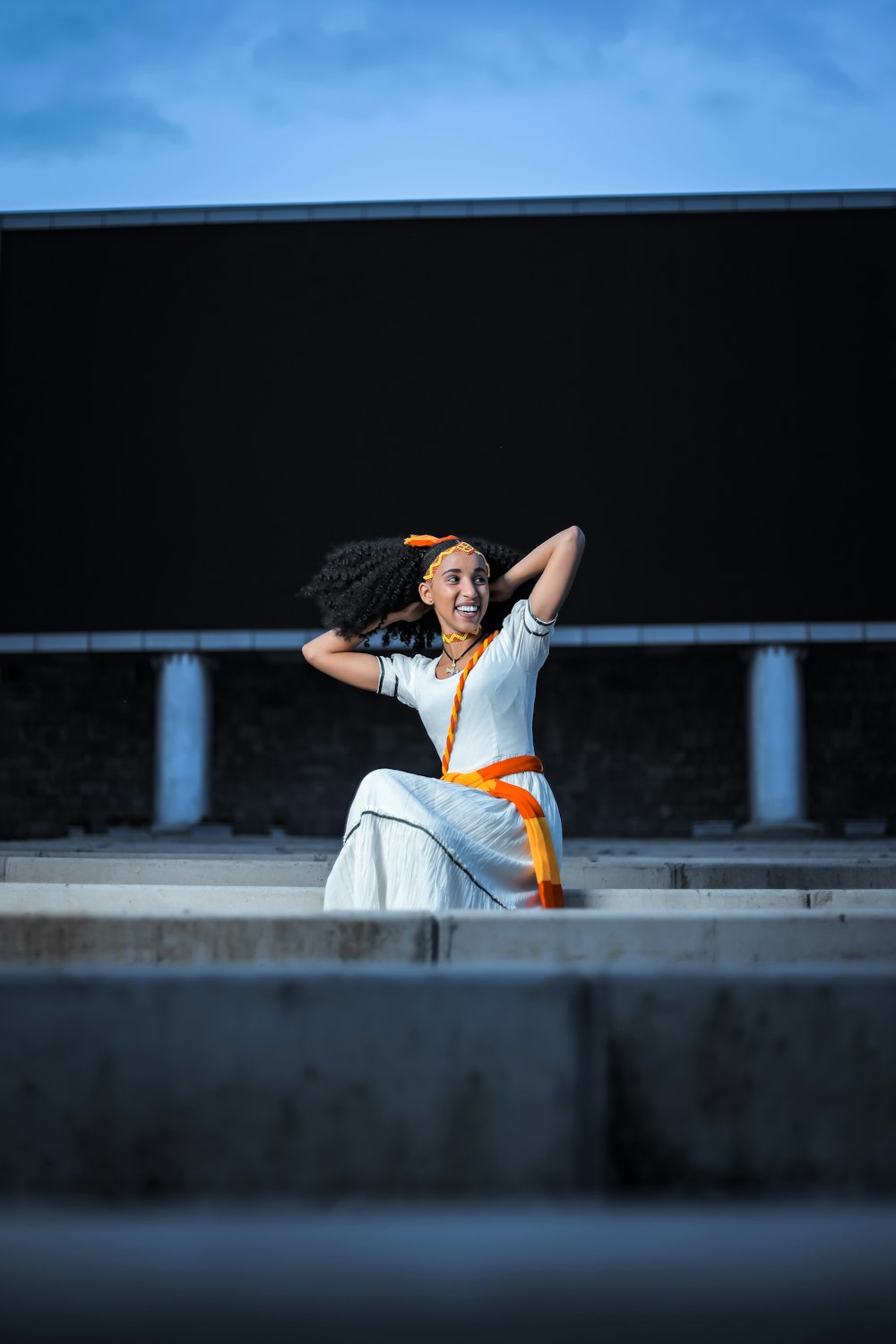 a person sitting on a ledge