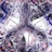 A complex abstract design features swirling patterns and shapes with a blend of lines and textures. The artwork includes a combination of smooth curves and sharp, jagged lines, predominantly in shades of black, white, red, and blue.