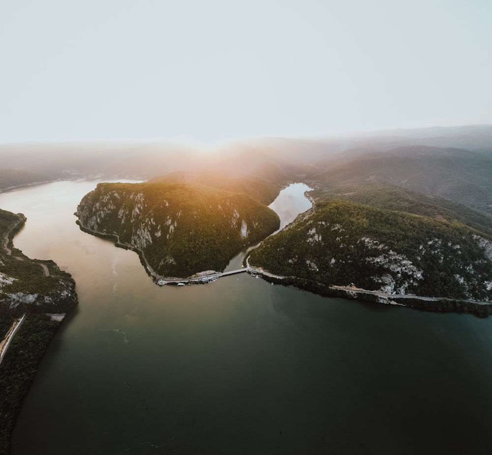 a body of water with a rock in the middle