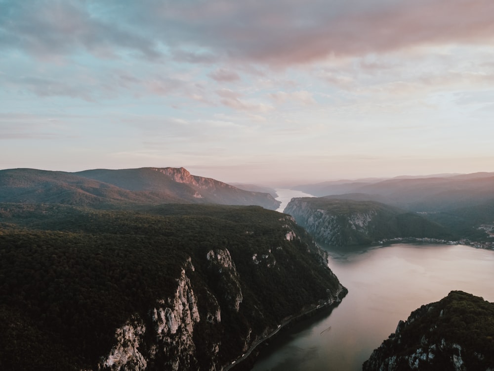 a mountain with a body of water below