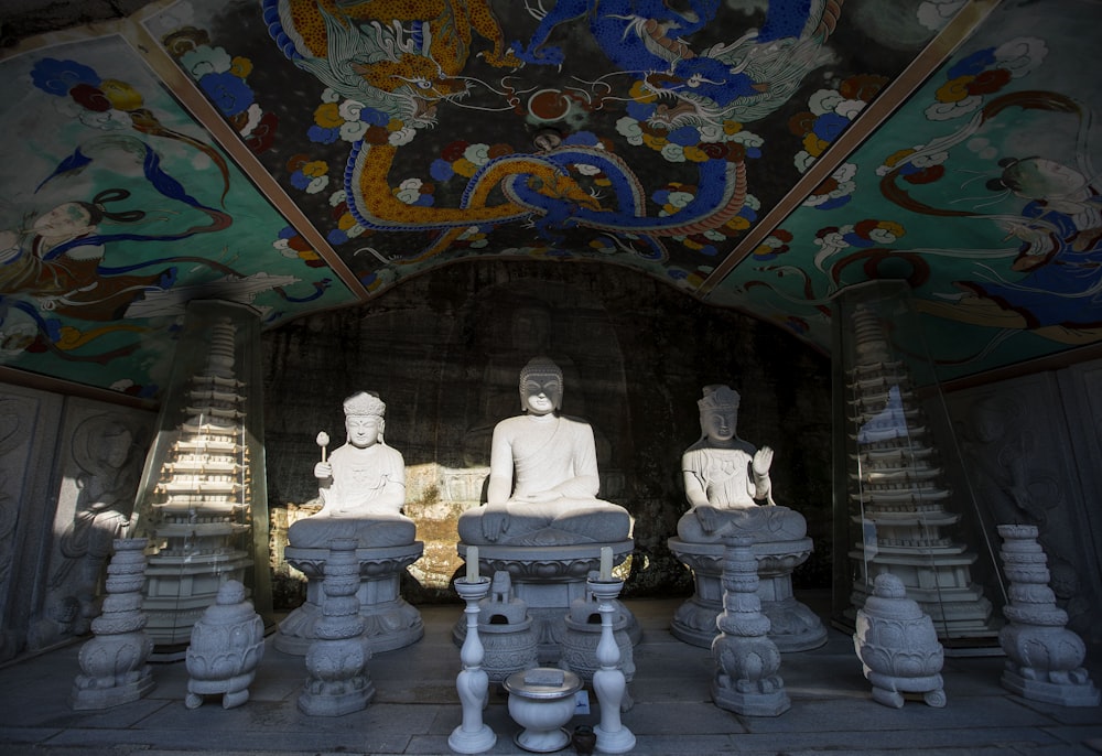 a group of statues in a room