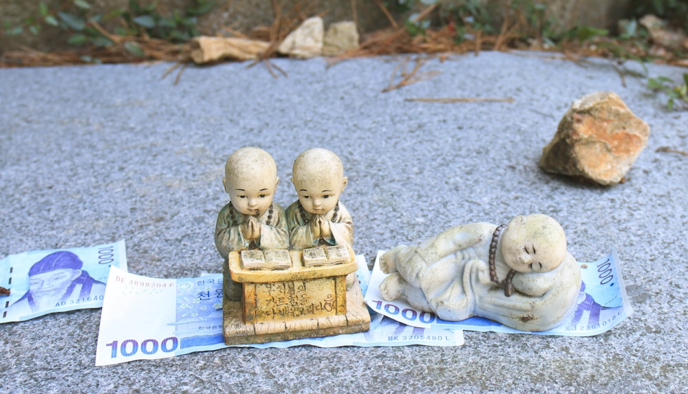 a group of statues on the ground