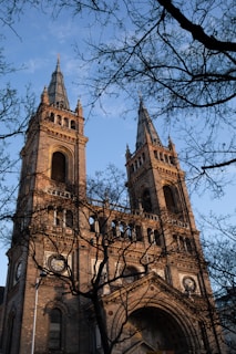 a large building towers over a city